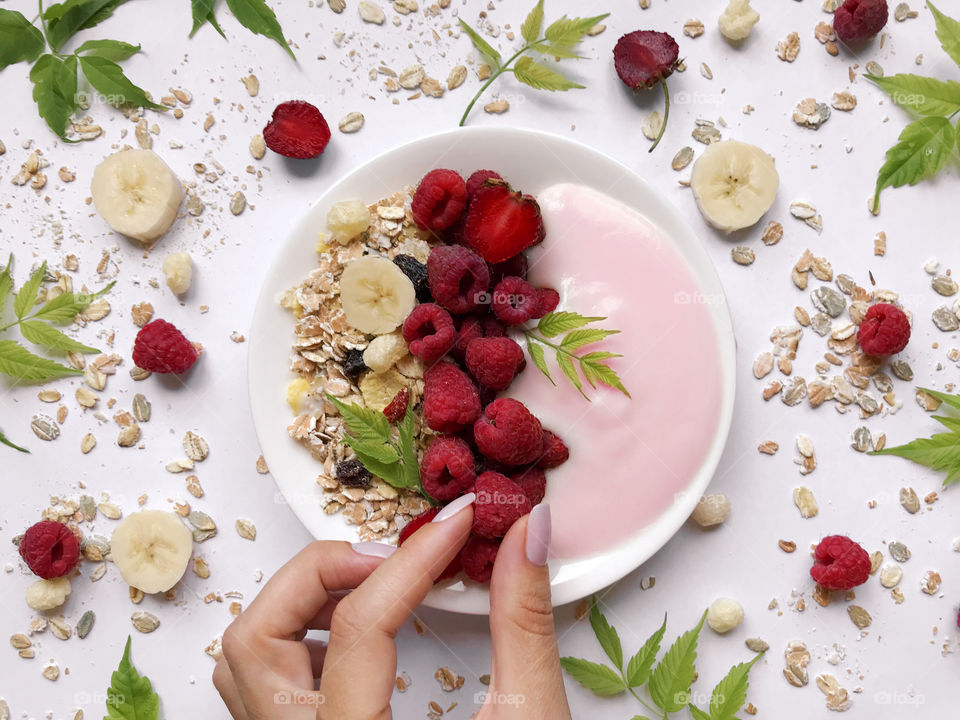 Yogurt with muesli and fresh ripe berries 