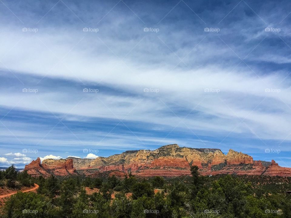 Clouds over red rocks