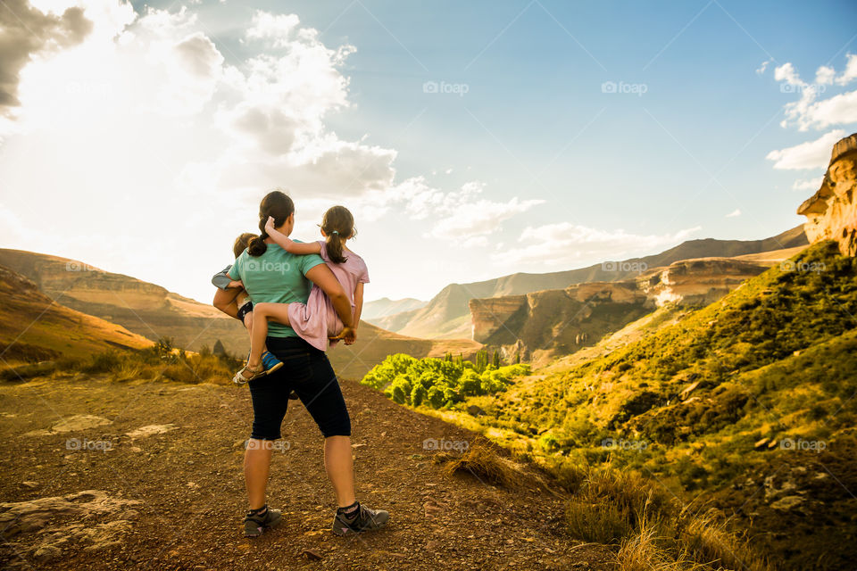 This I love and treasure - family! Image of woman and children admiring the sunset over the sandstone mountains in South Africa. Beautiful hike with beautiful scenery.