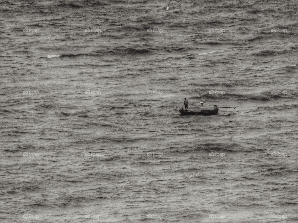 Small boat in Big sea. Small boat at Jomtien beach , Pattaya , Thailand