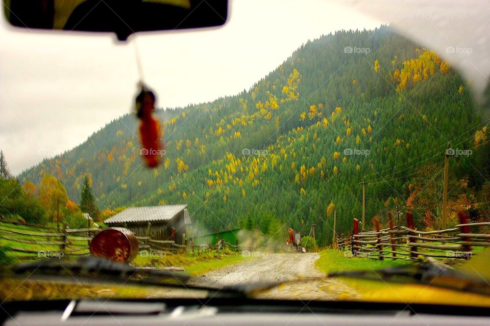 Driving the car in the village. Carpathian Mountains. 