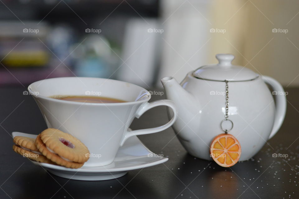 Breakfast with cup of tea and biscuits