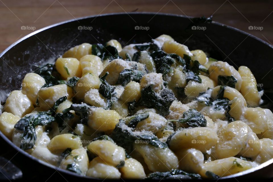 Close-up Of pesto gnocchi With spinach