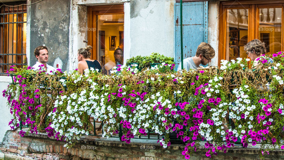 Couple Romantic Dinner In A Outdoor Restaurant Balcony
