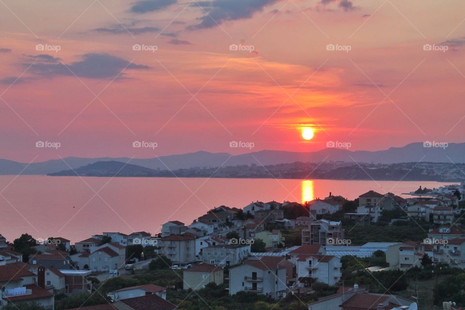 View of town at seaside suring dusk