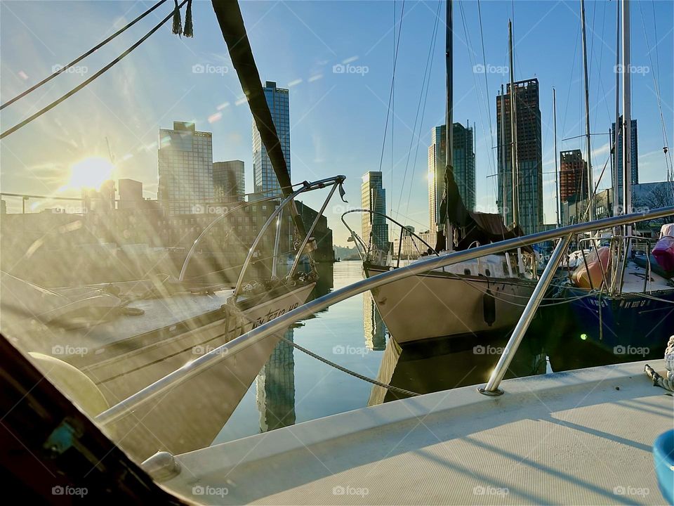 Late in the afternoon the sun shines directly into our boat window aboard “Salvation”, the “28 ft 1969 Luhrs” cabin cruiser at “Newtown Creek” in LIC, Queens that is home to me and my longtime partner “Timothy Trespas”. 2023. Hypnotic Productions