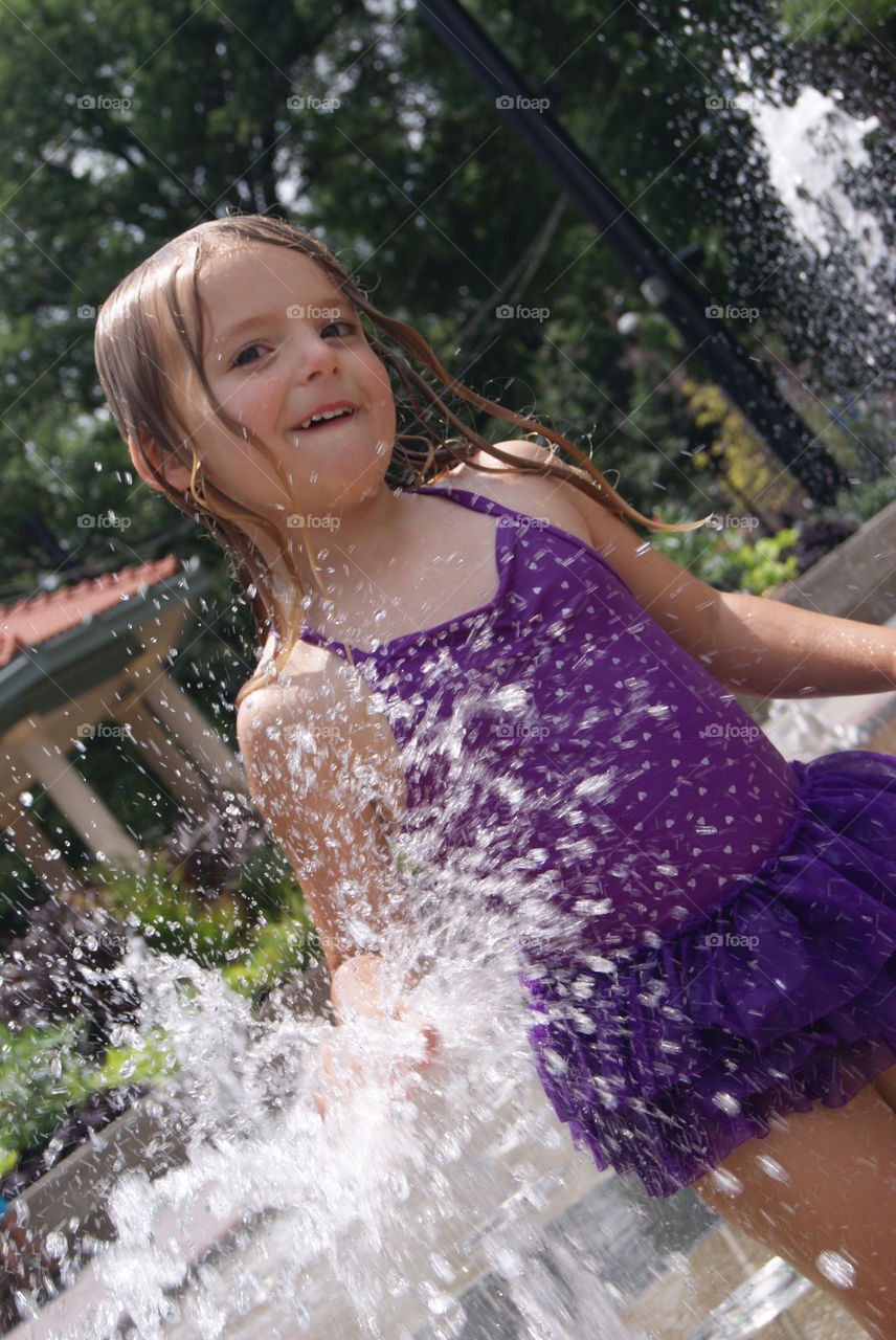 Little girl splashing water