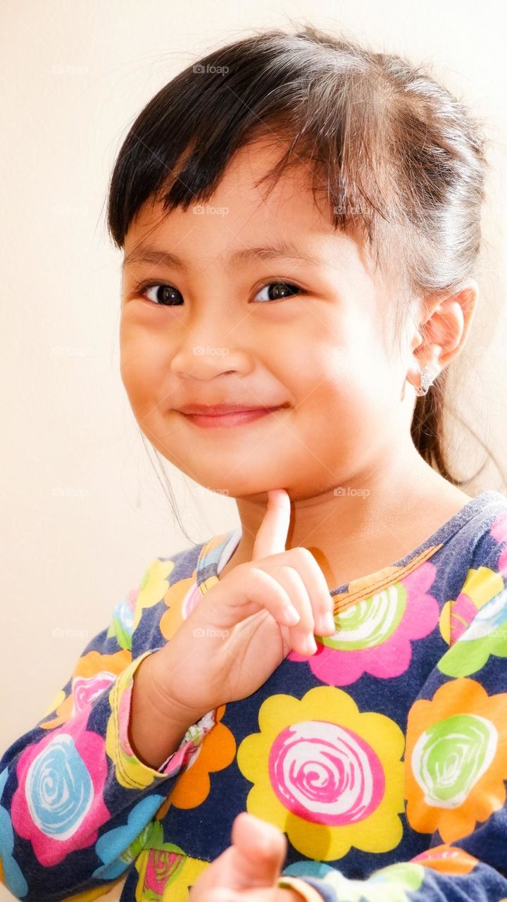 close up photo of little asian girl.