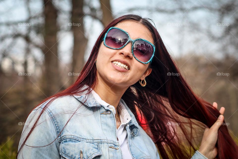 Stylish young woman with long straight hair