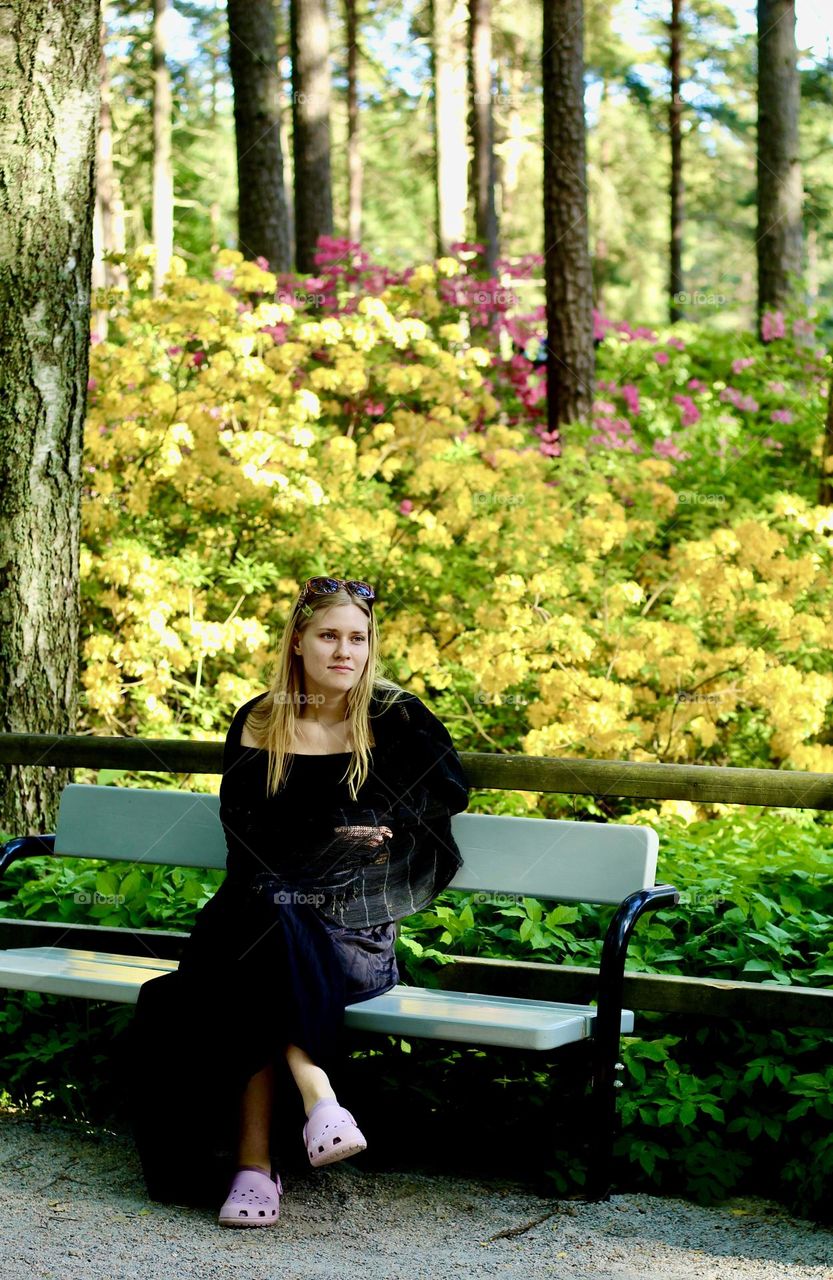 Girl at alpine rose park at Haagan alppiruusupuisto in Helsinki, Finland