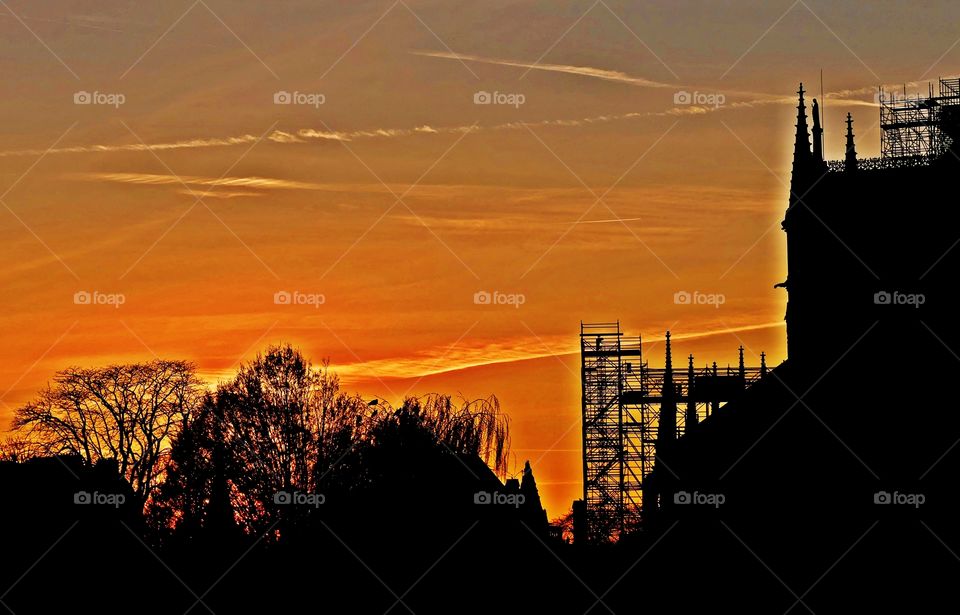 Golden hour time - A spectacular golden sunset surrounds the silhouette of scaffolding, birds in the tree tops and the Cathedral. Just as the sun sets you get those lovely shadows and everything looks gold and yellow.