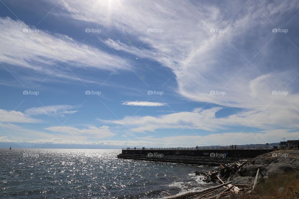 clouds over breakwater 