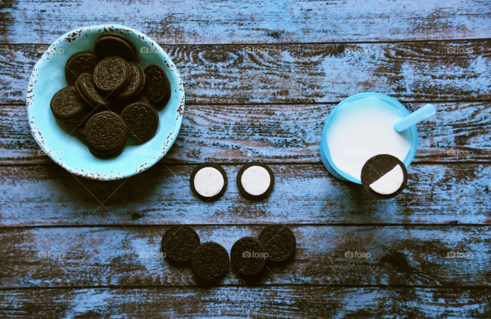 Smiley face from Oreo cookies and milk 