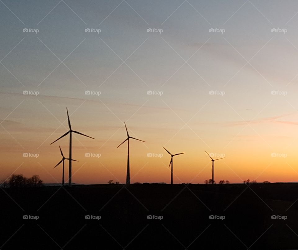 Wind engines in sunset