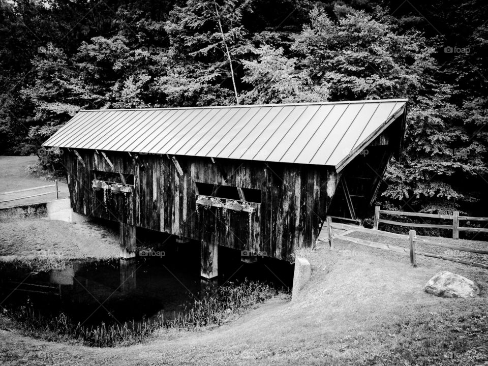 B & W Rustic and vintage wooden covered bridge