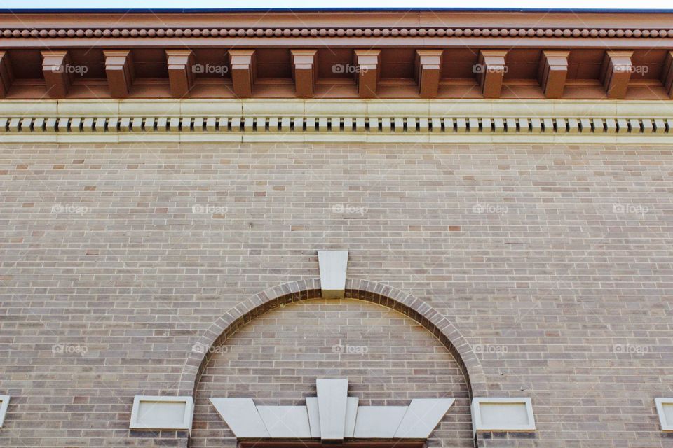 Architectural detail on the overhang and side of an historical building