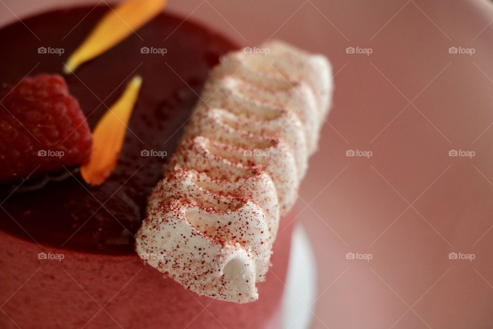 Meringue on top of the mousse cake laying on pink plate.. life is sweet 😉