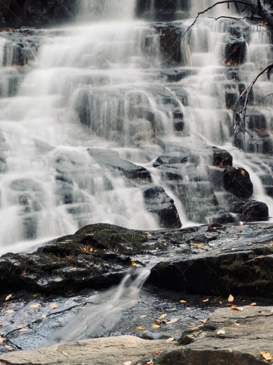 Long exposure photo of waterfalls on the bottom of the rocks