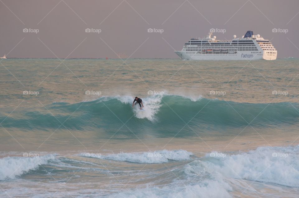 Man surfboarding on sea