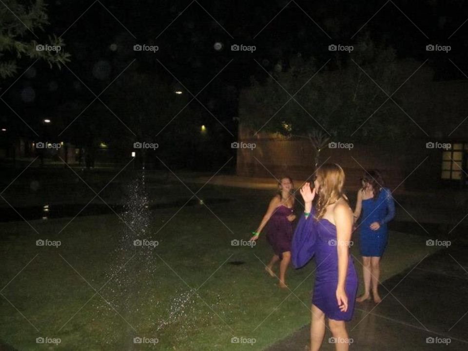 playing in the sprinklers 