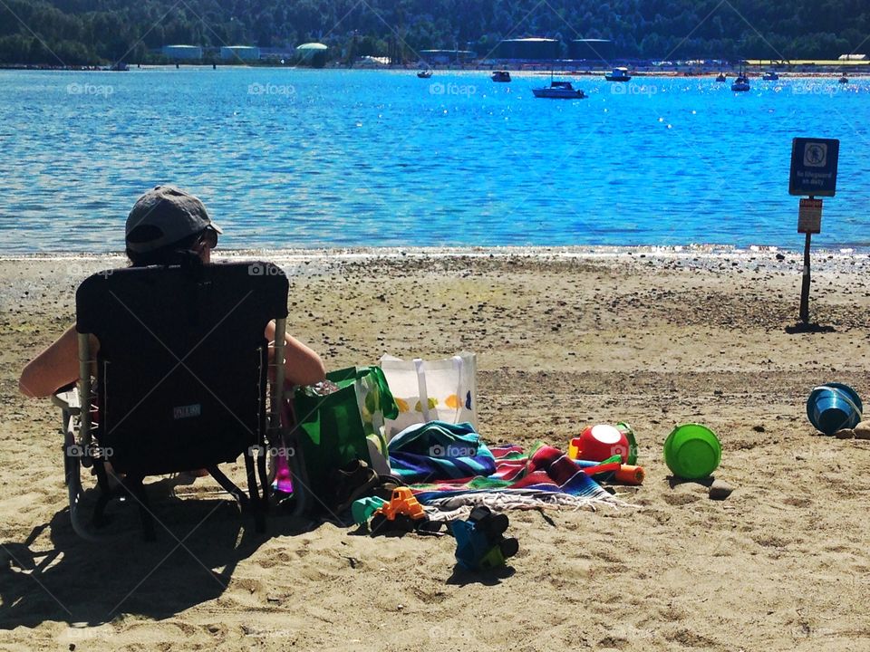 Mother relaxing on beach