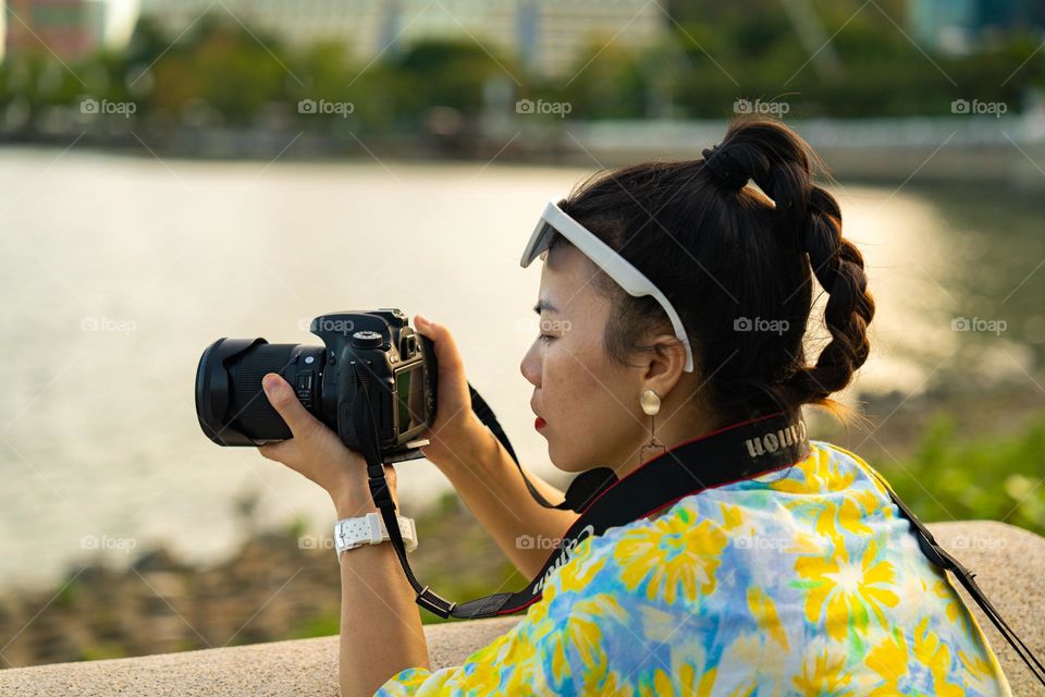A girl is capturing the photo