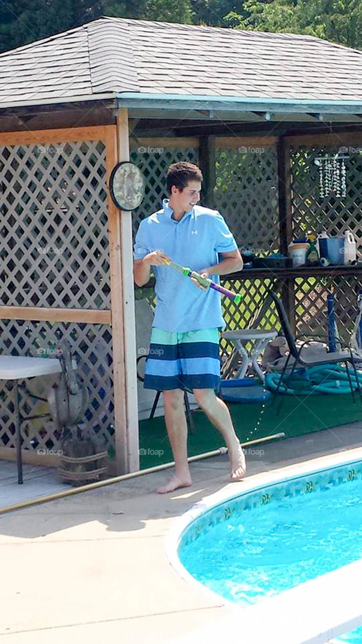 cabana boy. teenage boy at pool