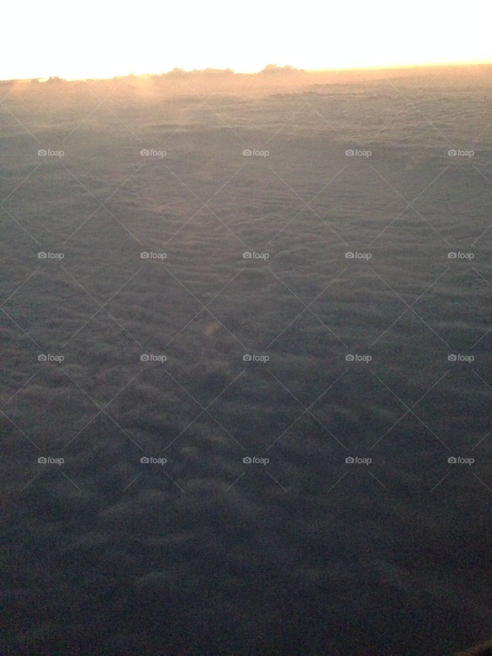 Picture of clouds from plane window.