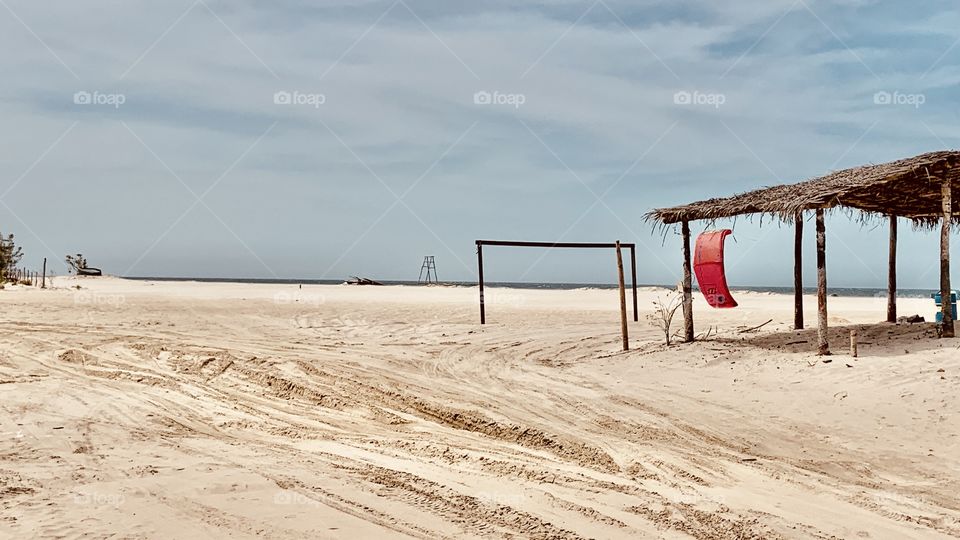 Kitesurfing and football door in a desert beach 