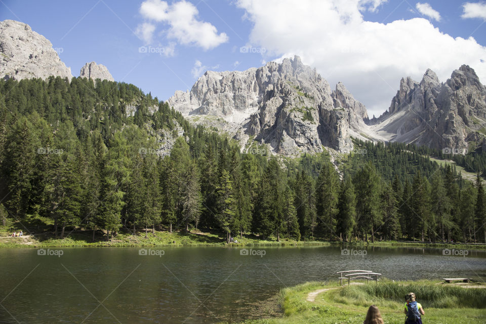 Hiking trail by the lake in the mountains 