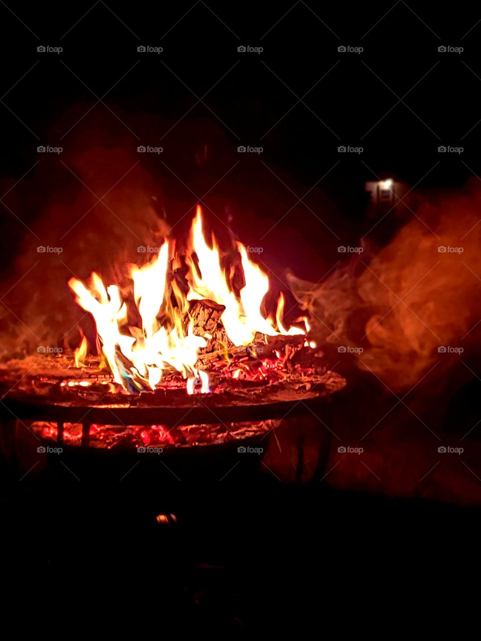 campfire with red smoke