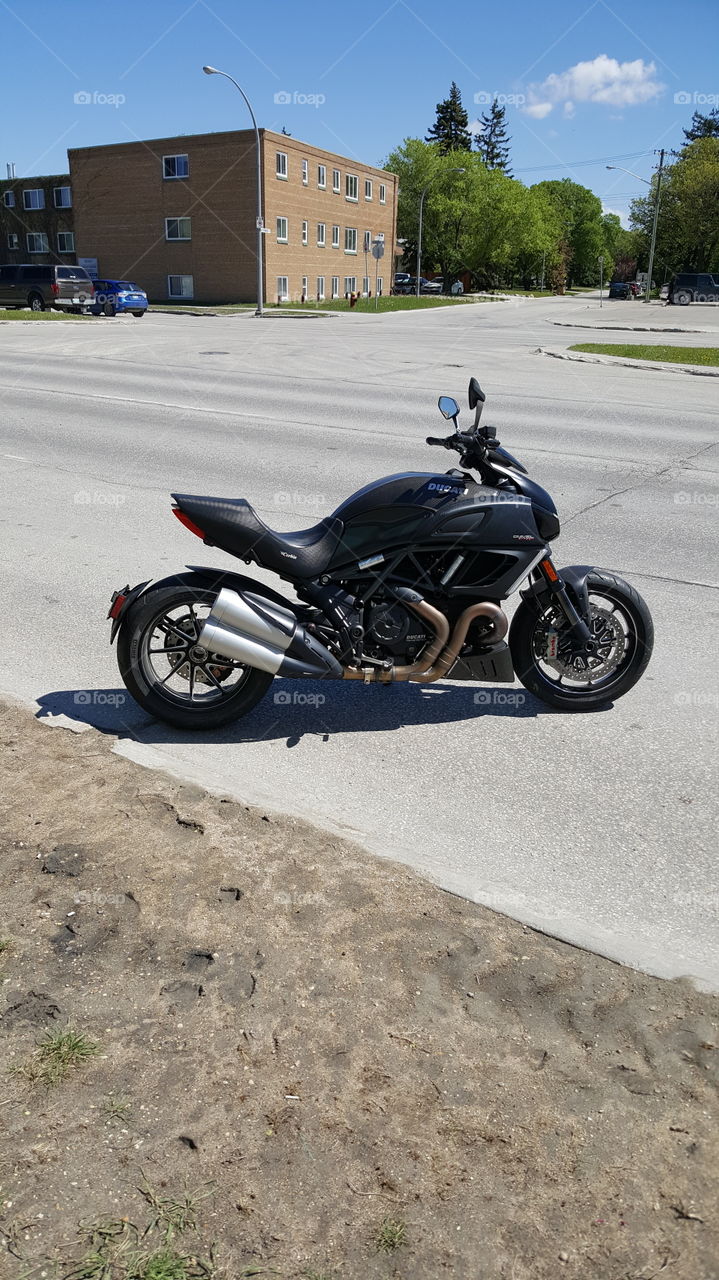 Ducati black motorcycle / motorbike on my walk