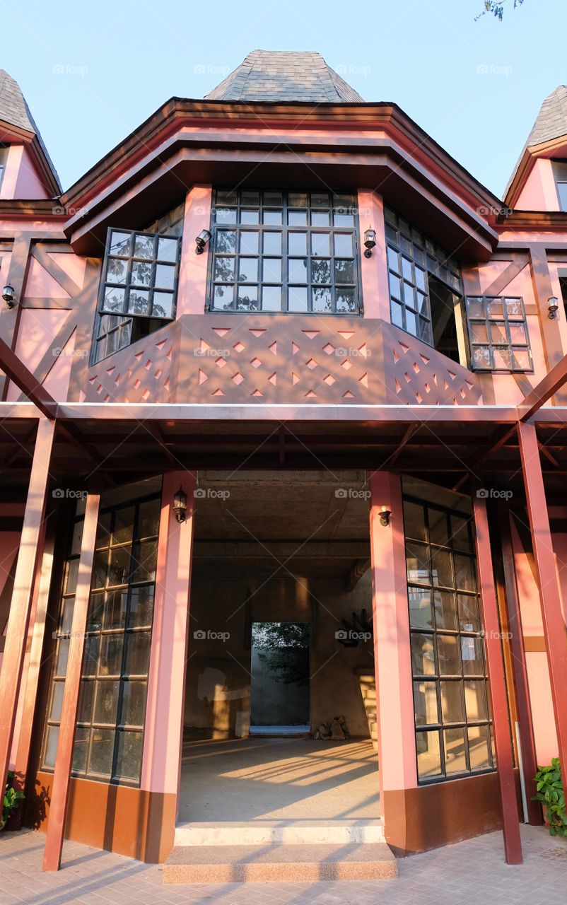 Front view at the entrance of a red house