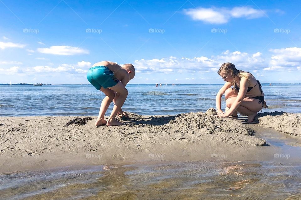 Digging in the sand at the beach