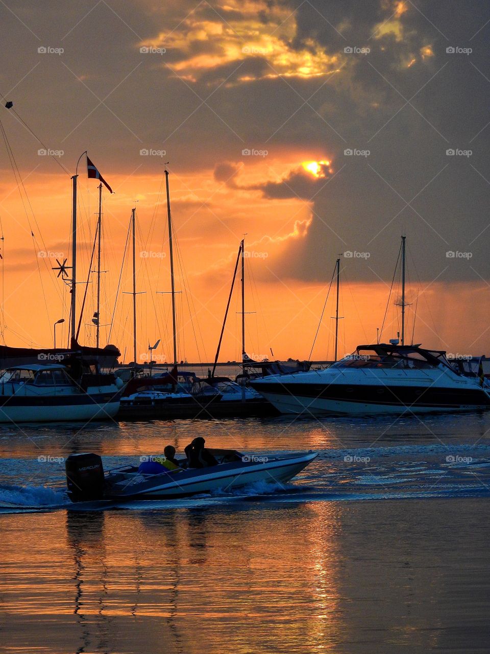 Motor boat in sunset