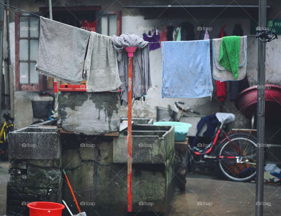 Clothes lines on the side of a Shanghai street.