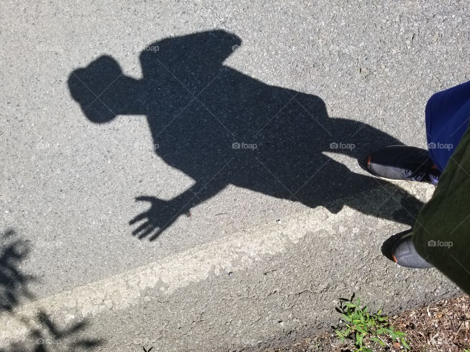people shadow on street