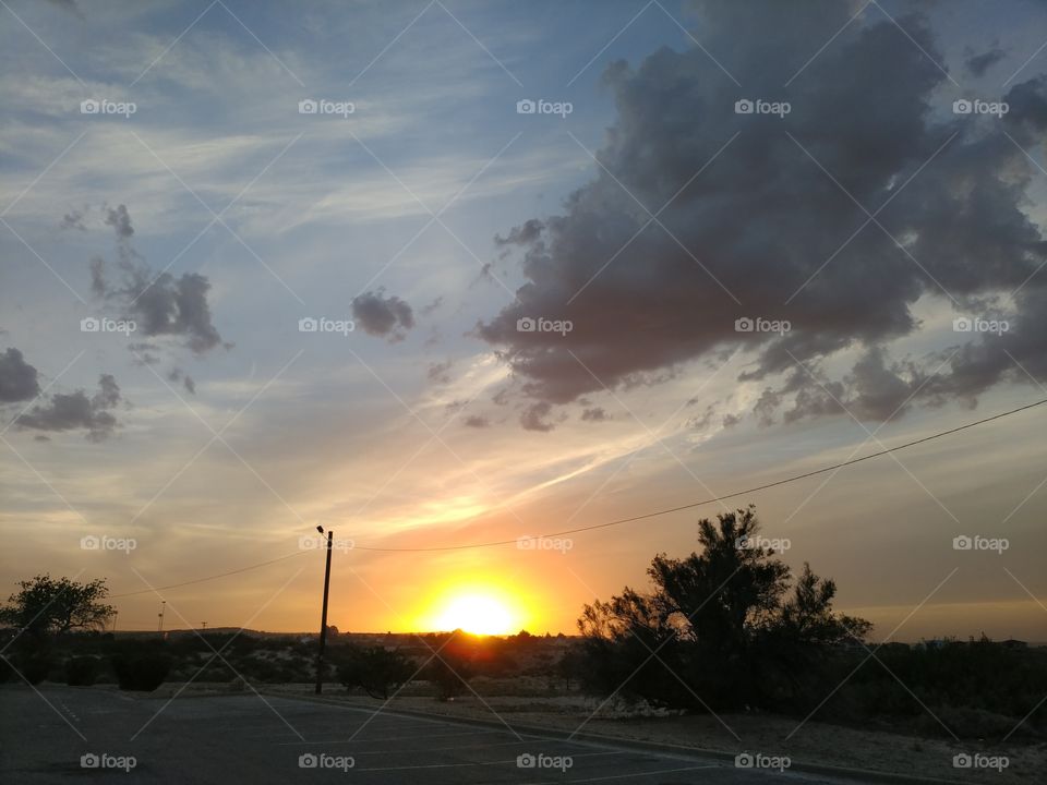 sunset in desert parking lot