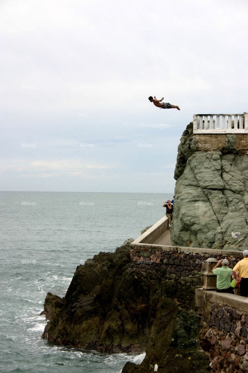 Leap of faith. Cliff diver in Mazatlan, Mexico.  They dive for tips - no that's a bit extreme! 