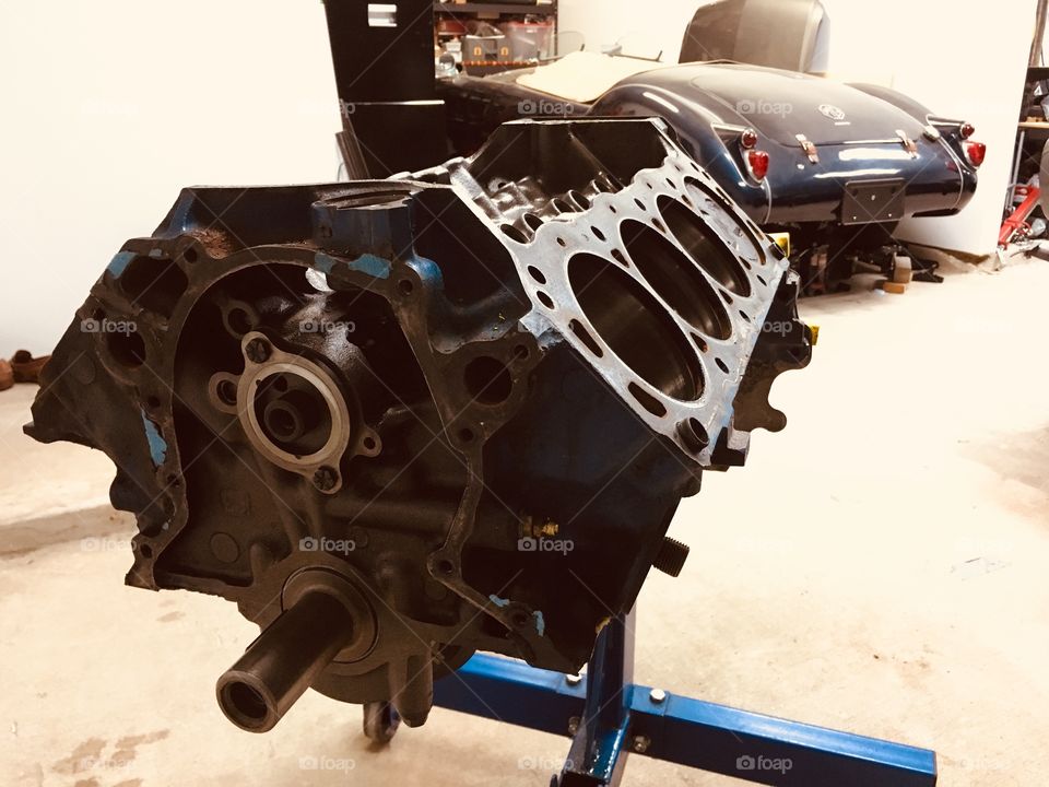 Engine rebuild late night in garage mga background