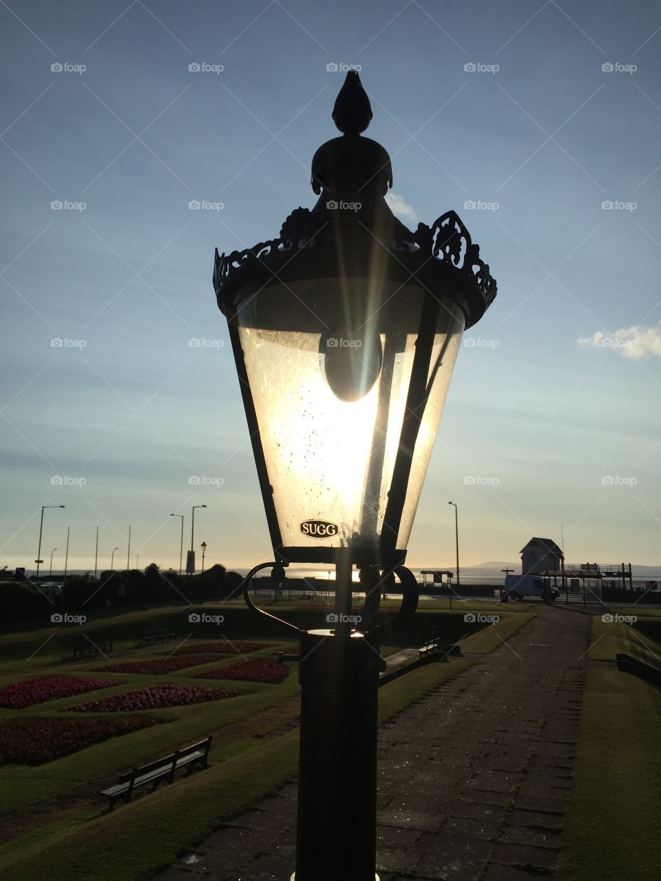 John Smalley . Sun behind lamp post morcambe sea front 