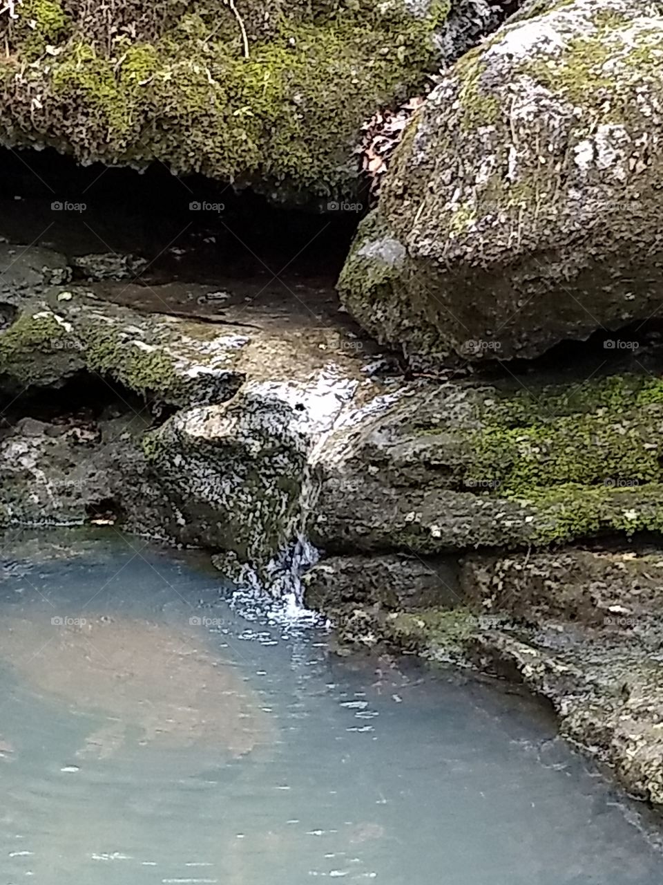 Mini waterfall in a creek.  Missouri.