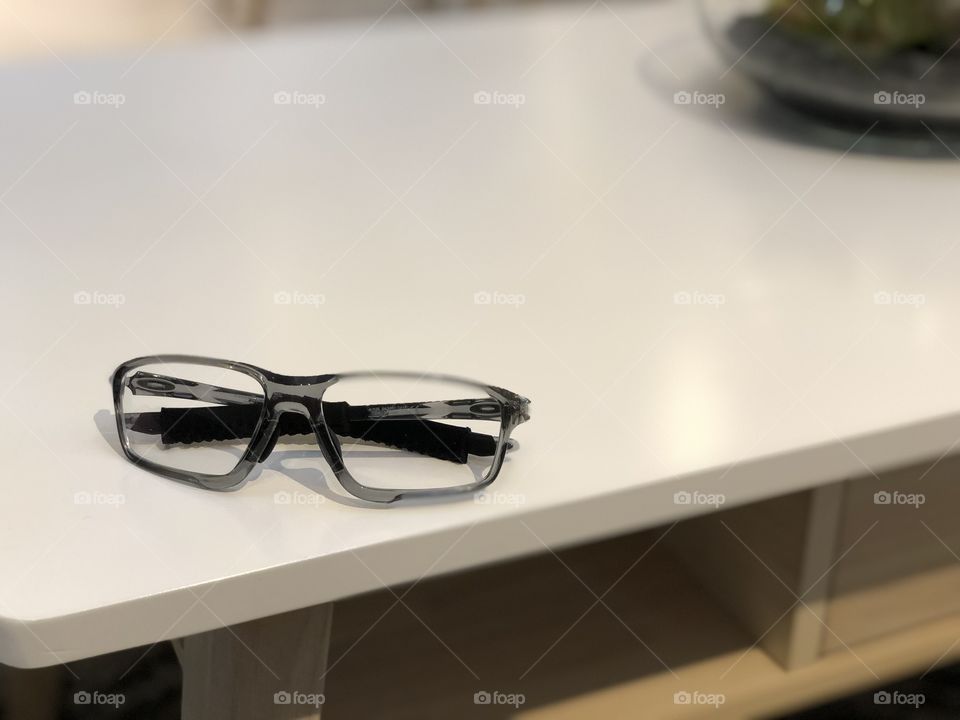 Eye glasses on table
