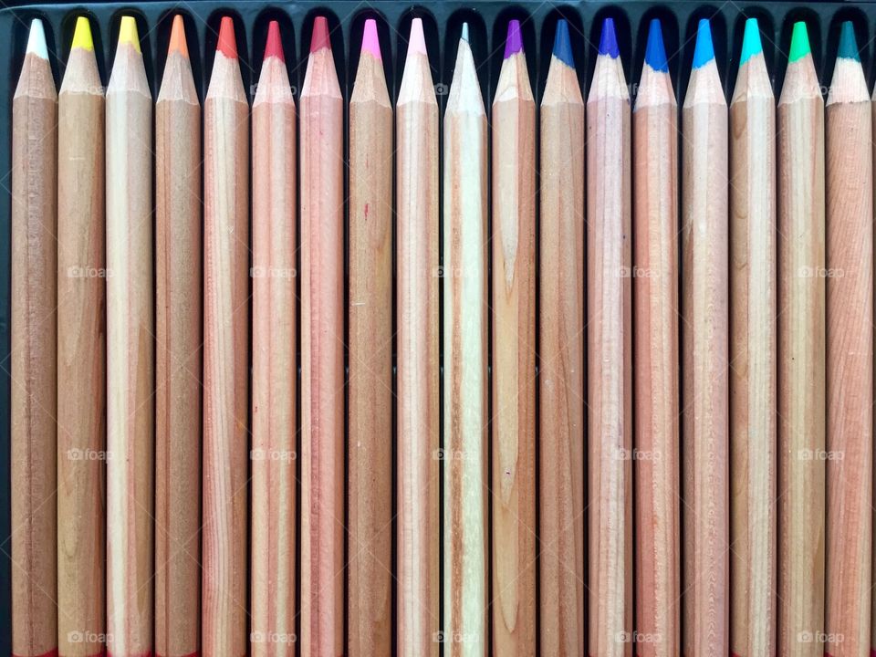 Colored wooden pencils and a straight one 