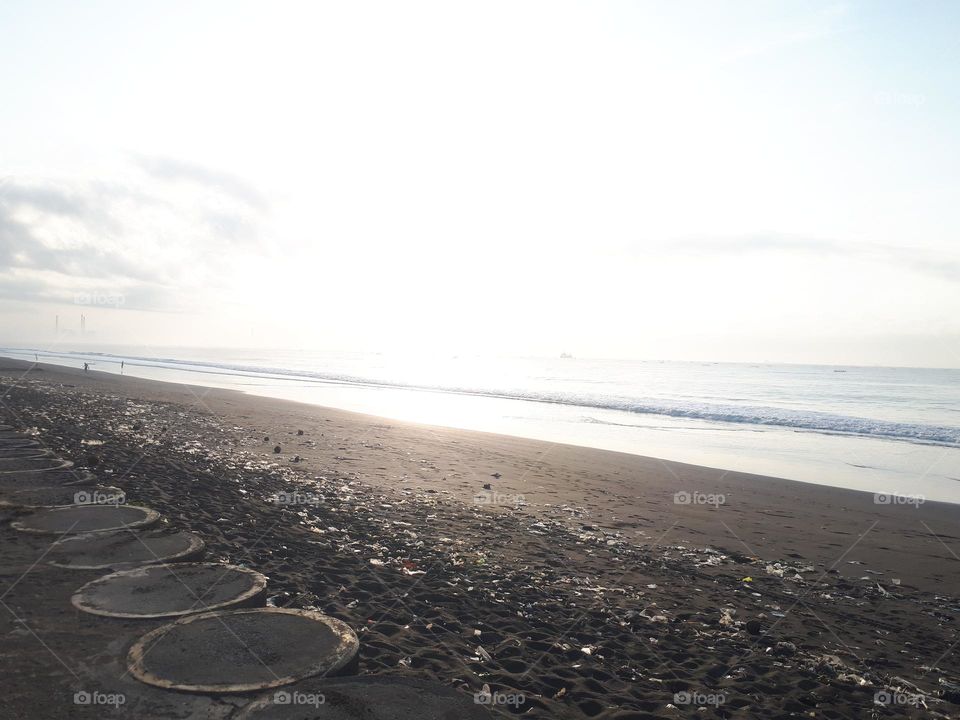 Stunning natural scenery with a wide beach and calm waves is perfect for surfing or a summer holiday