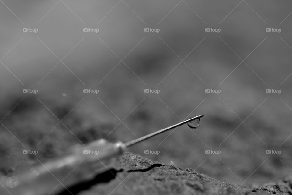 syringe with drop