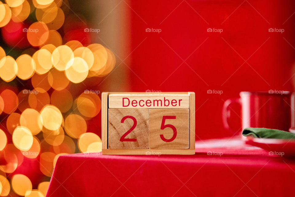 Christmas background with wooden block calendar with the date of December 25