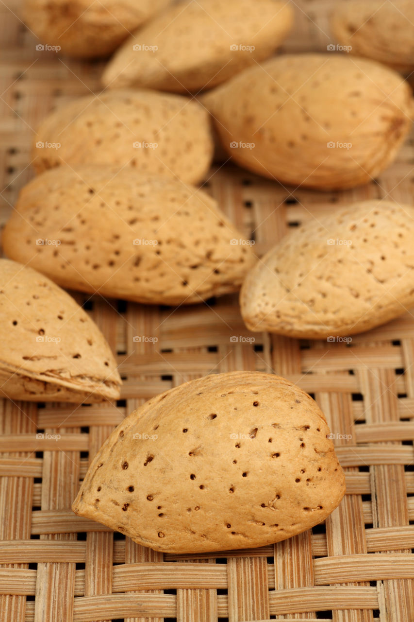 Almonds Shells on a wooden background