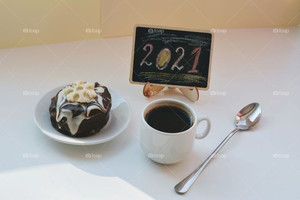 cup of coffee with cake on a white background 2021