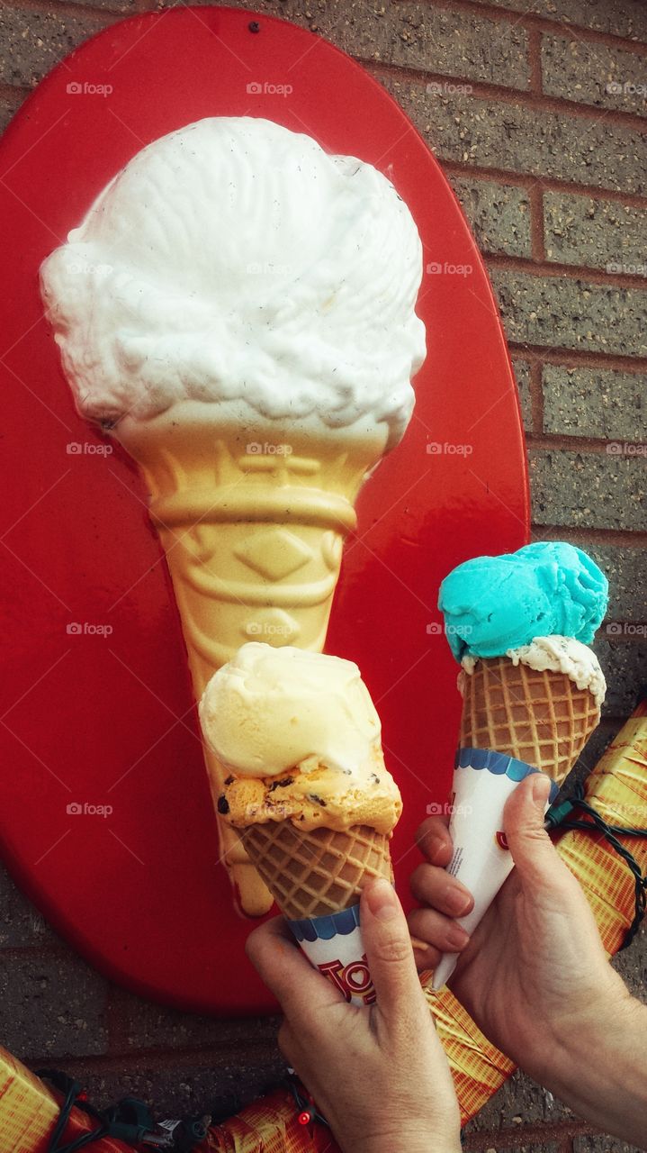 Hands Holding Ice Cream